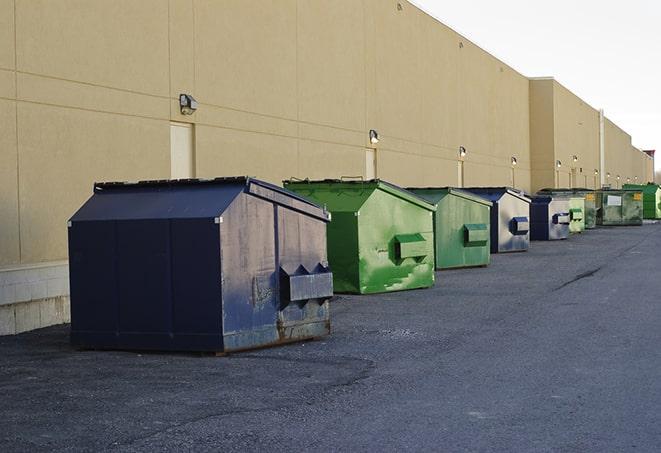 a group of construction workers taking a break near a dumpster in Elk Grove